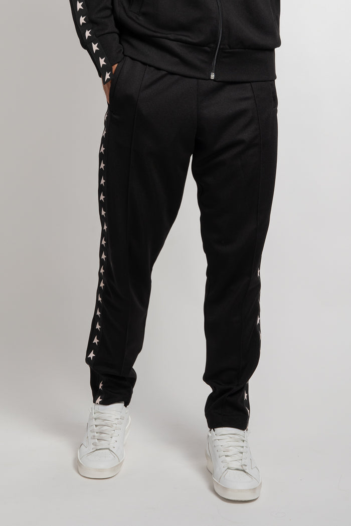 Pantalone jogging di colore nero con stelle bianche sui lati-1